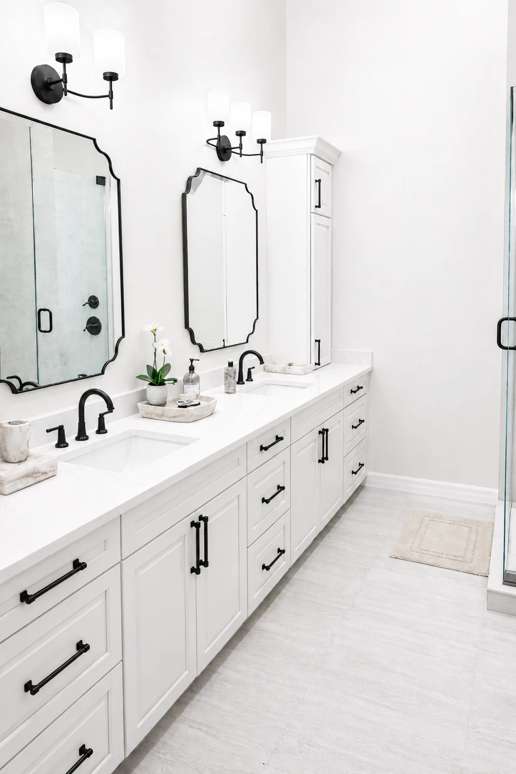 White shaker double vanity close-up — black matte fixtures, framed mirrors, clean staging