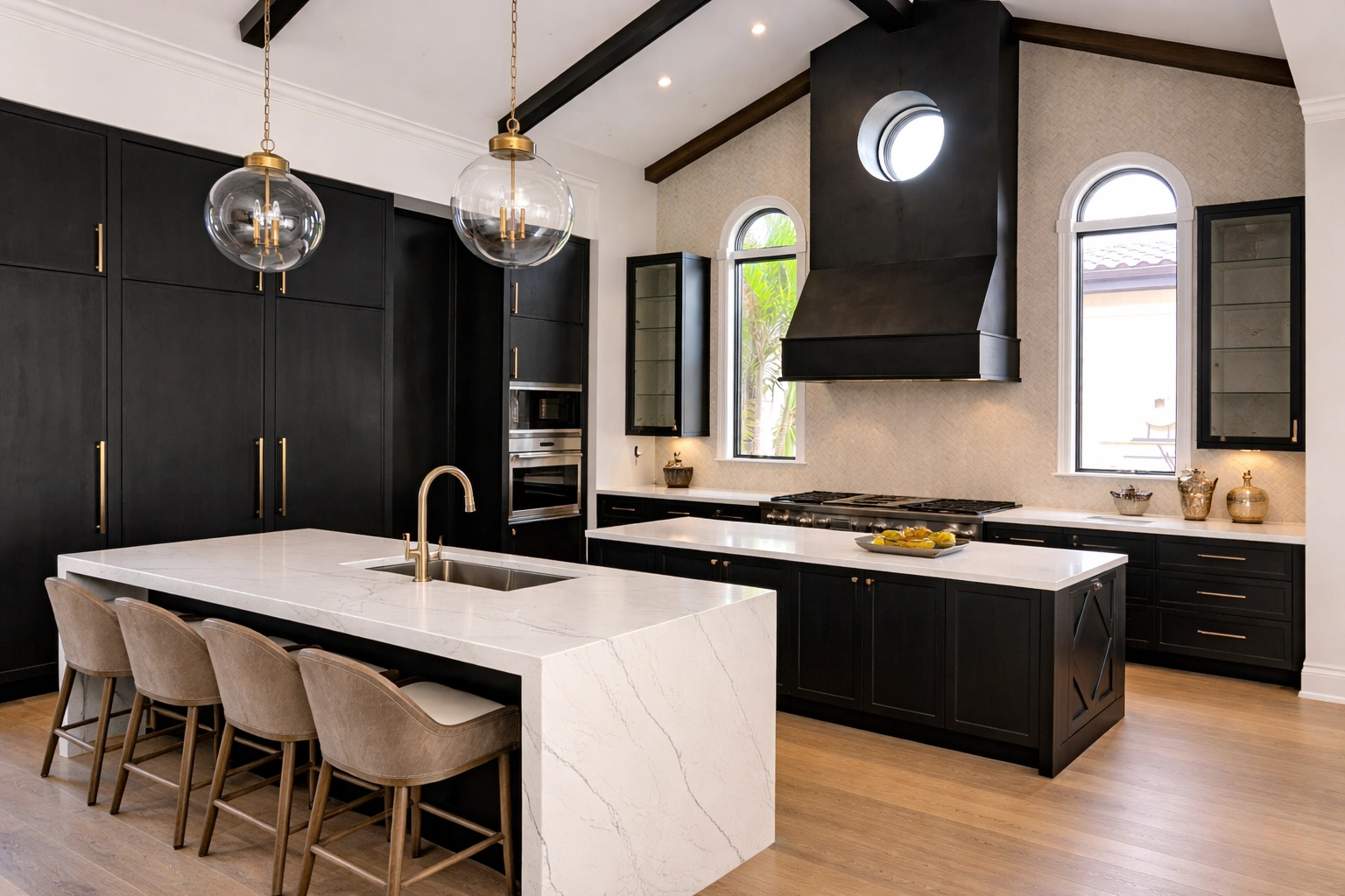 Dramatic black modern kitchen — dark cabinetry, gold fixtures, marble island, vaulted ceiling