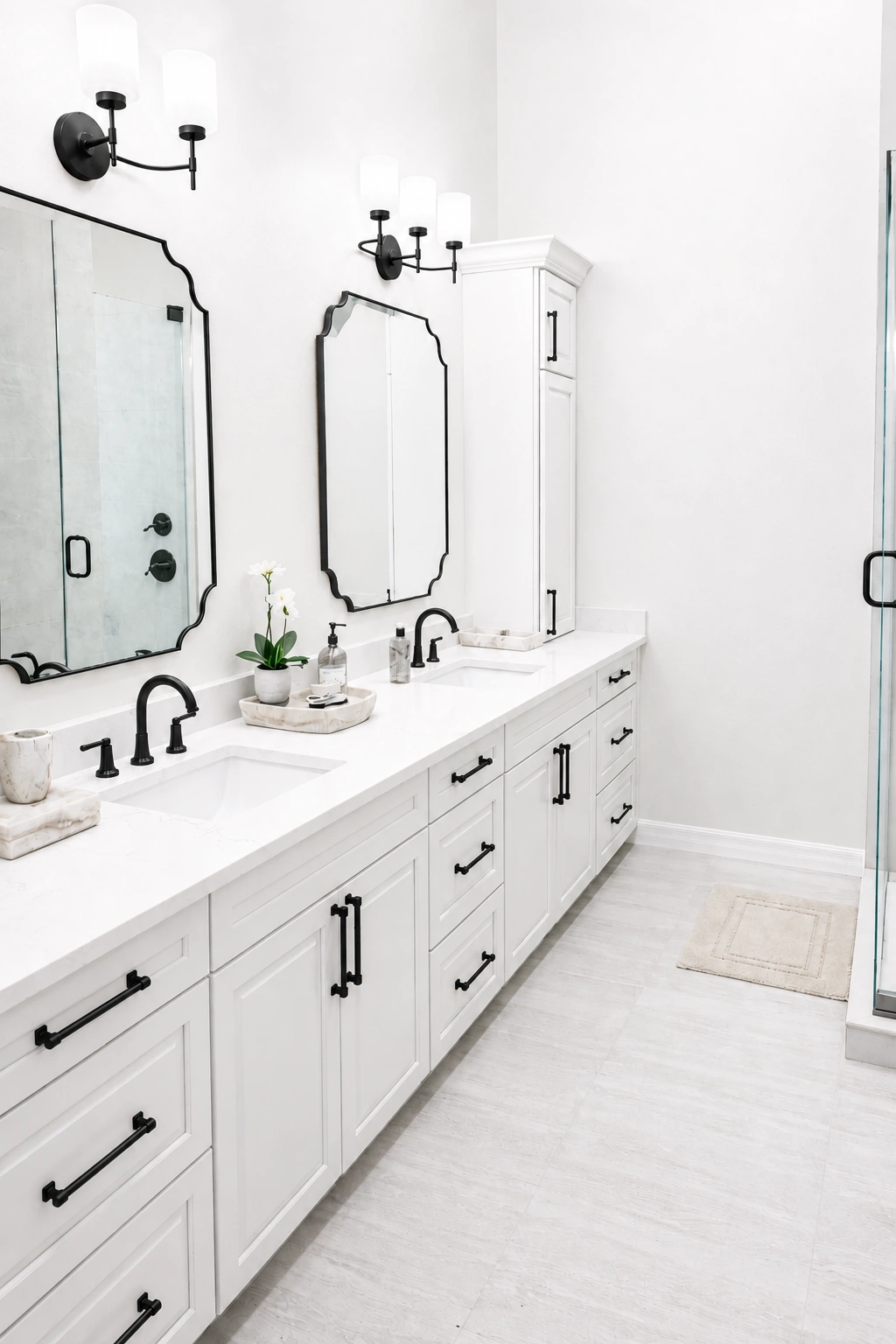 White double vanity close-up — black matte fixtures, framed mirrors